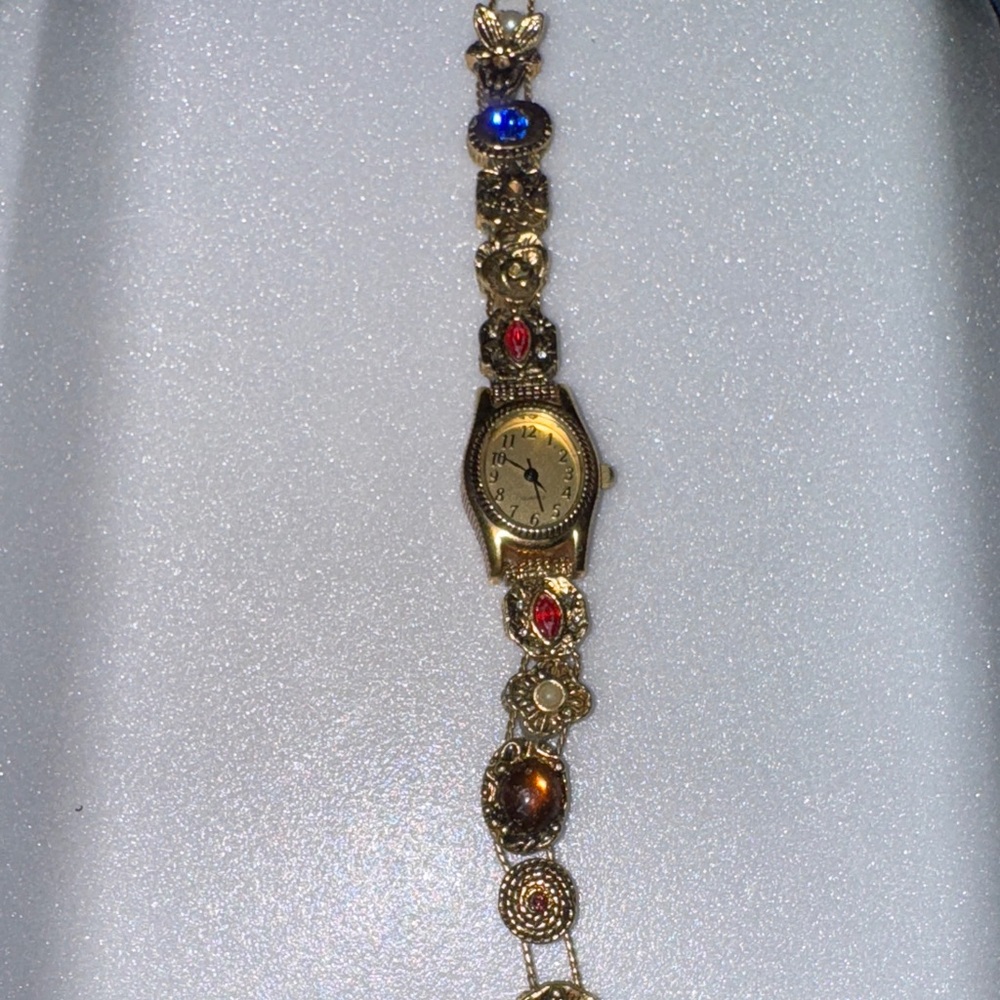 Vintage Avon fashion Wristwatch with gemstone accents and a gold tone chain